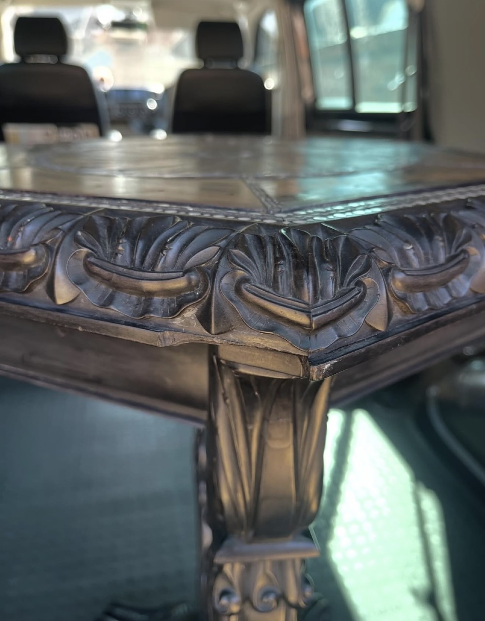 A pair of 19th-century Ceylonese ebony hexagonal occasional tables featuring inlaid geometric specimen wood tops and carved scroll legs. View XI