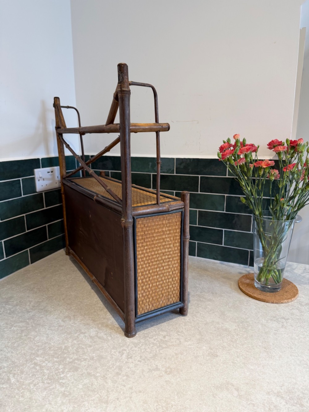 A Victorian bamboo and woven cane wall cupboard featuring two lower cabinet doors, an open upper display shelf, and an X-shaped cross support. View IV