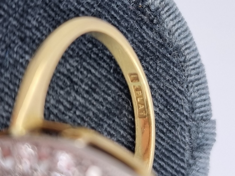 An antique navette-shaped cluster ring crafted in yellow gold with a platinum setting face set with multiple diamonds. View III