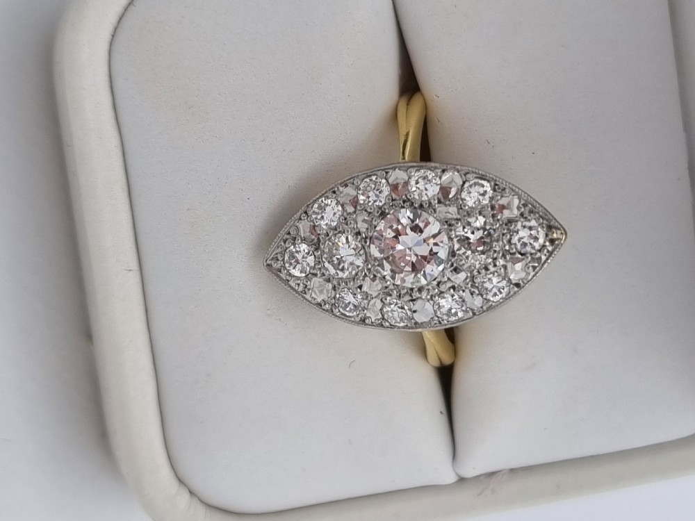 An antique navette-shaped cluster ring crafted in yellow gold with a platinum setting face set with multiple diamonds. View V