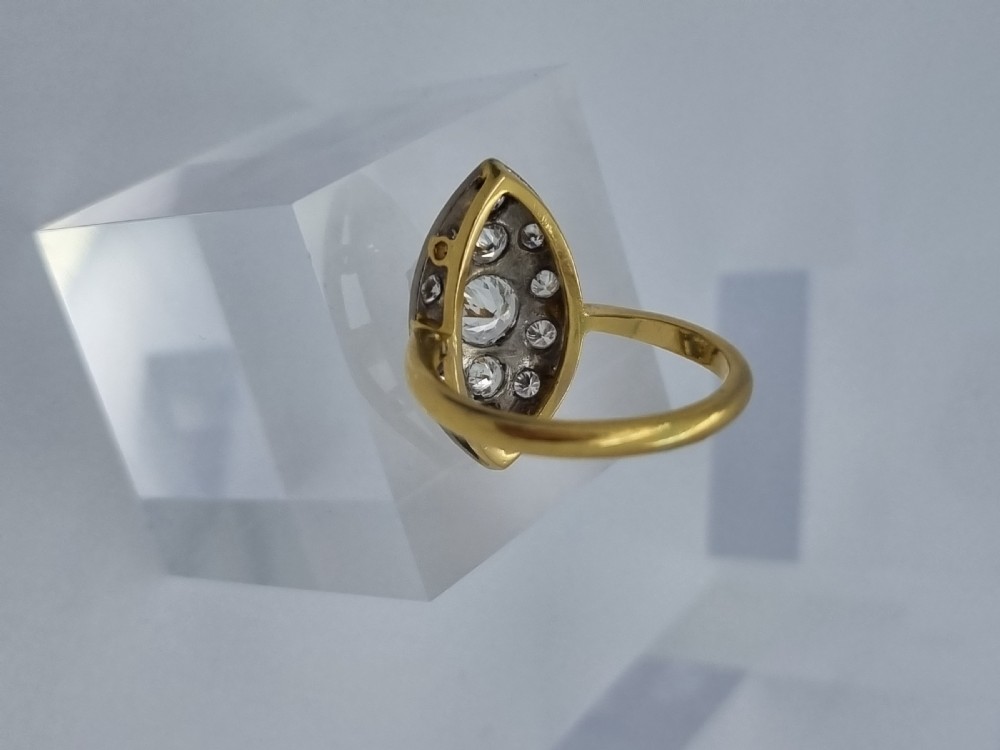 An antique navette-shaped cluster ring crafted in yellow gold with a platinum setting face set with multiple diamonds. View IX