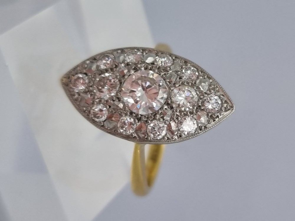 An antique navette-shaped cluster ring crafted in yellow gold with a platinum setting face set with multiple diamonds. View XI
