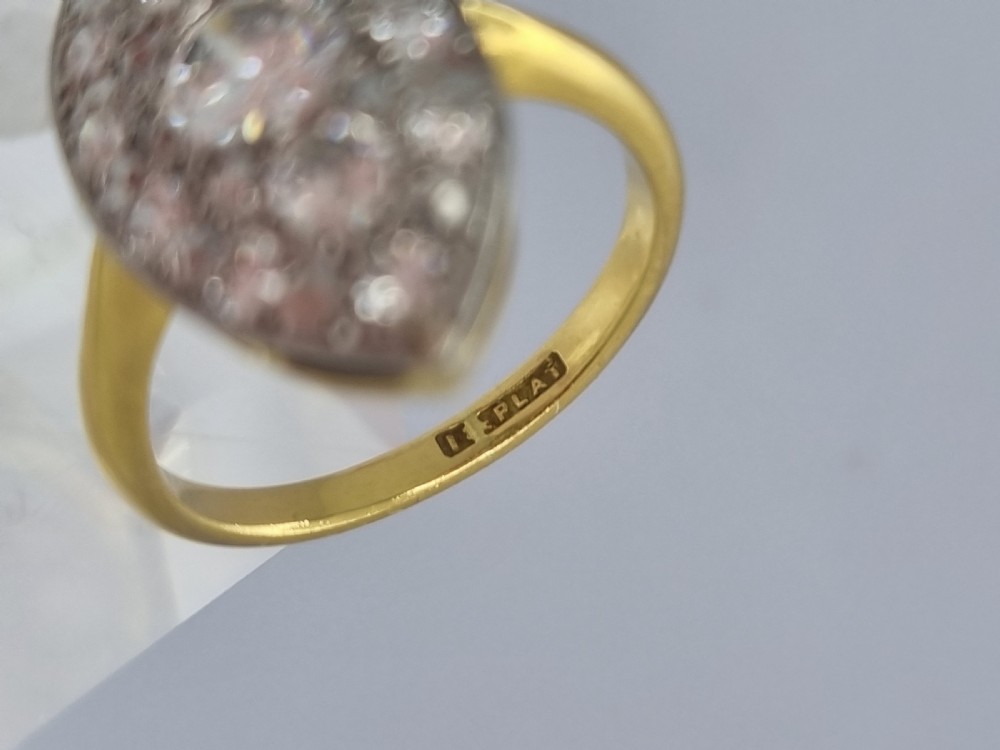 An antique navette-shaped cluster ring crafted in yellow gold with a platinum setting face set with multiple diamonds. View XII