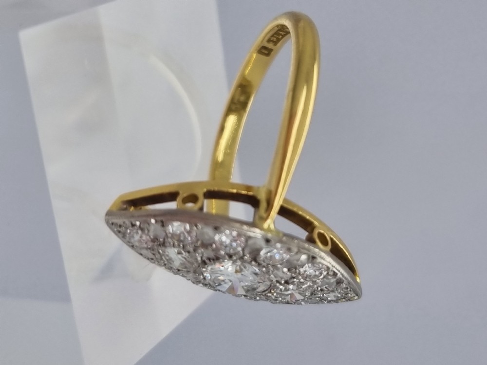 An antique navette-shaped cluster ring crafted in yellow gold with a platinum setting face set with multiple diamonds. View XIV