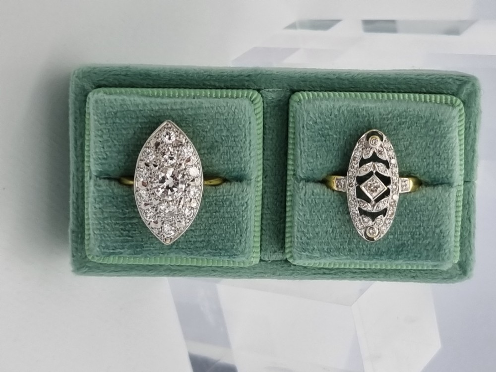 An antique navette-shaped cluster ring crafted in yellow gold with a platinum setting face set with multiple diamonds. View XVII