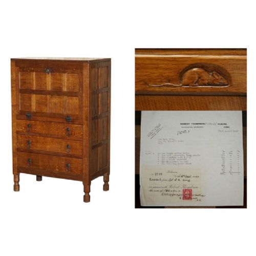 fig 1. A solid oak fall-front bureau desk featuring three lower drawers, panelled sides, and hand-forged wrought iron drop handles.