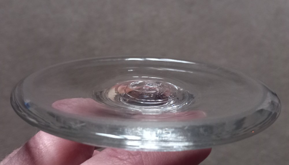 An antique clear glass rummer with a wide bowl engraved with a horse and rider motif, resting on a knopped stem and broad circular base. View XI