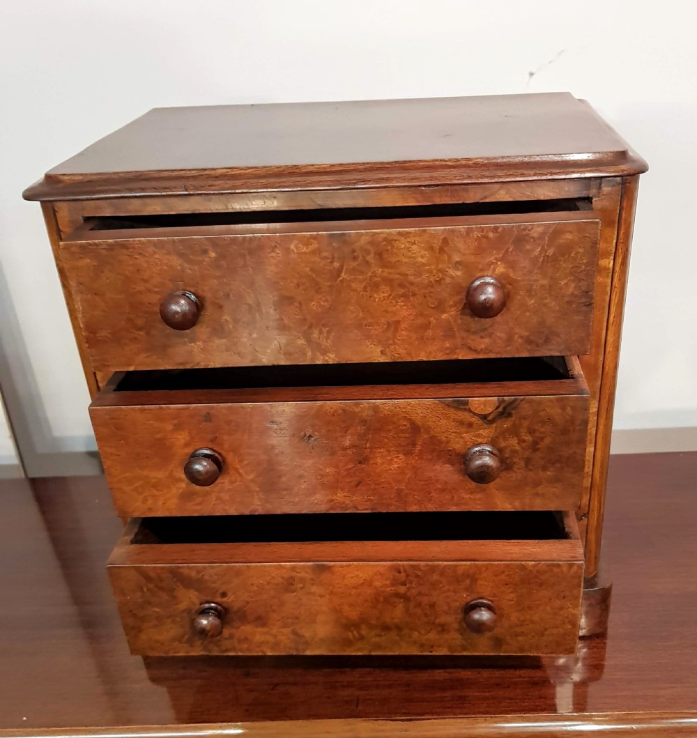 Miniature Victorian Burr Walnut Chest of drawers.  View II
