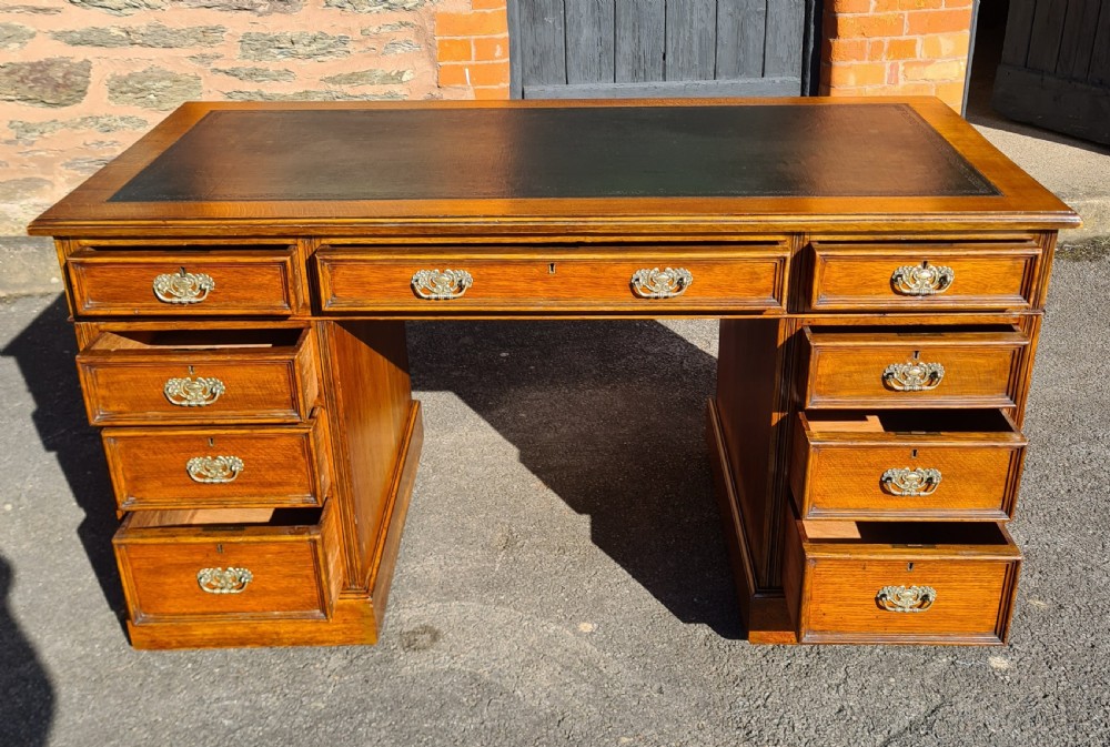 ANTIQUE VICTORIAN OAK NINE DRAWER DESK.  View III