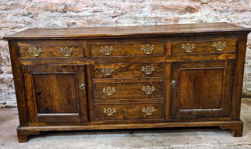 Georgian Elm and Oak Dresser Base .