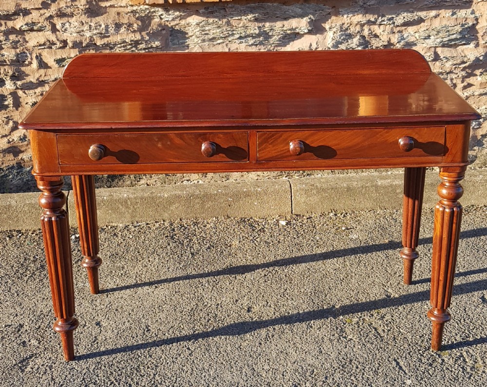 Victorian mahogany two drawer writing table. 