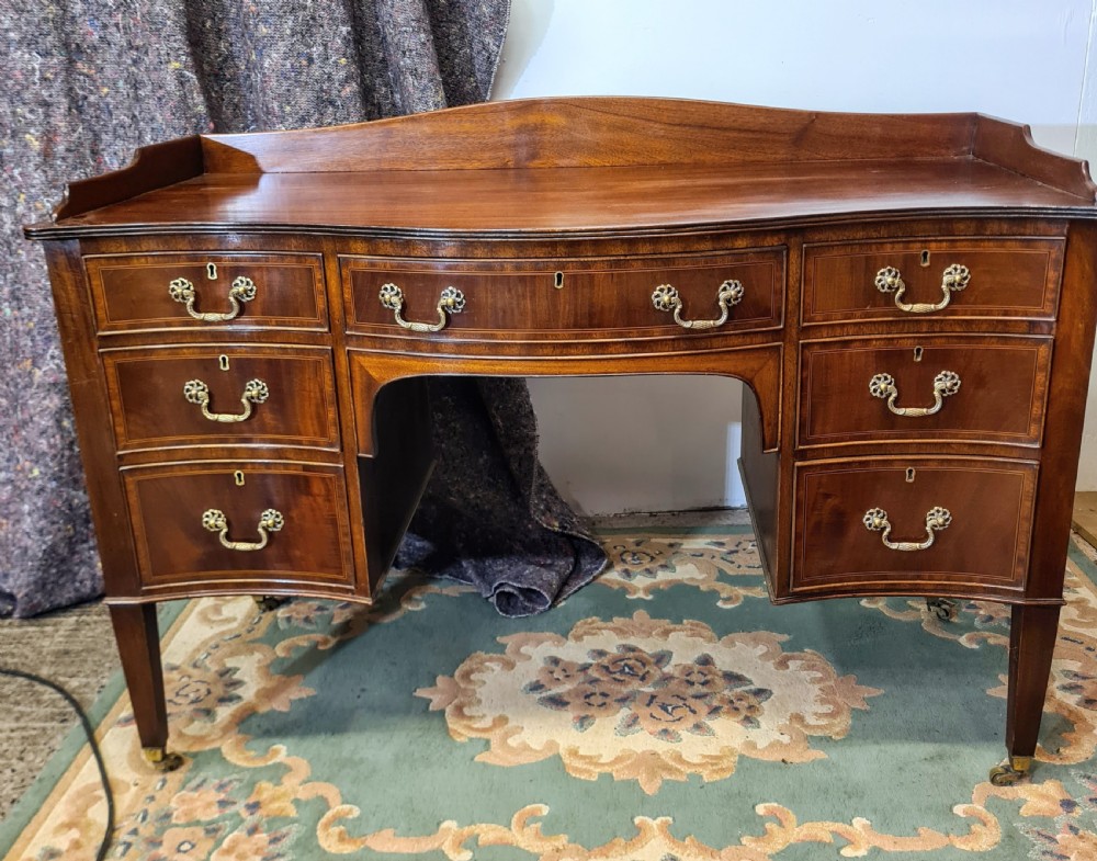 Edwardian Mahogany Serpentine Inlaid Desk. 