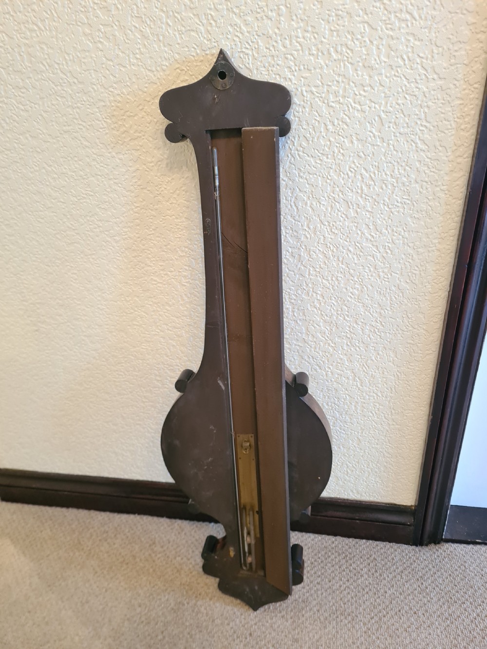 A 19th-century dark rosewood banjo barometer featuring intricate mother-of-pearl floral and bird inlays, an integrated thermometer, and a central round silvered dial. View IX