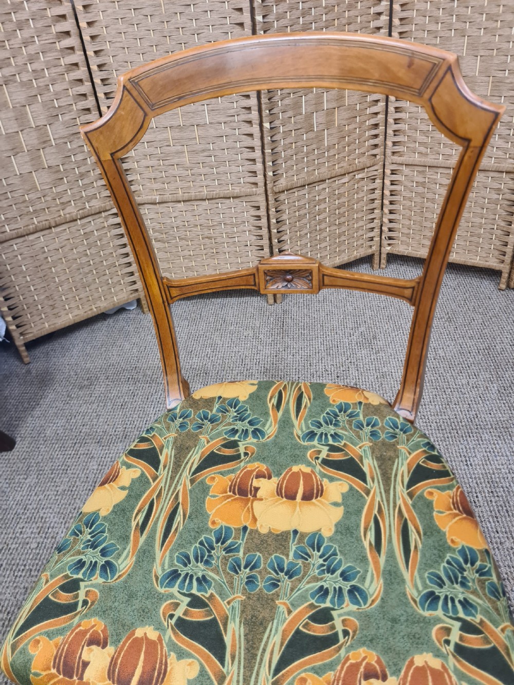 A pair of 19th-century satinwood side chairs featuring inlaid frames, open backs, turned fluted legs, and green floral pattern upholstery. View VII