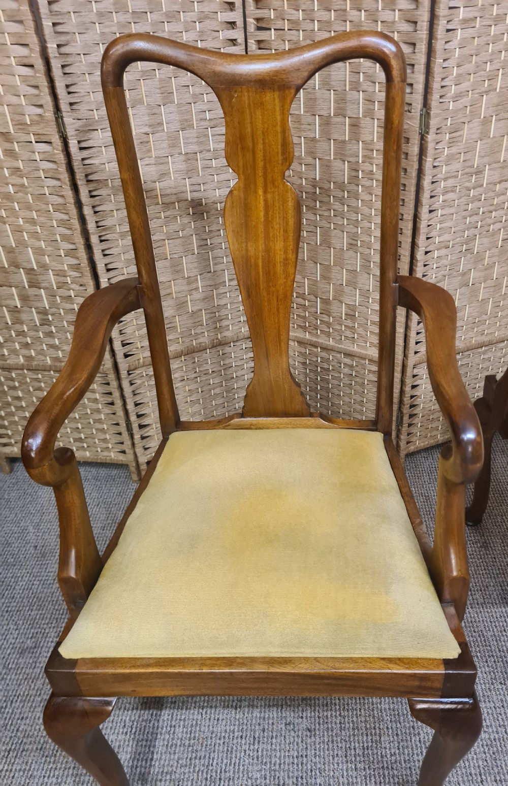 A pair of 1920s Queen Anne style walnut armchairs featuring vase-shaped splat backs, crook arms, cabriole legs with pad feet, and yellow velvet upholstered seats. View VI