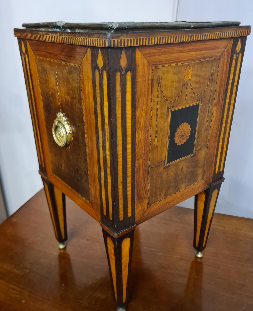 A square Dutch Neoclassical satinwood and rosewood marquetry wine cooler with inlaid floral swags, brass ring handles, and square tapered legs.