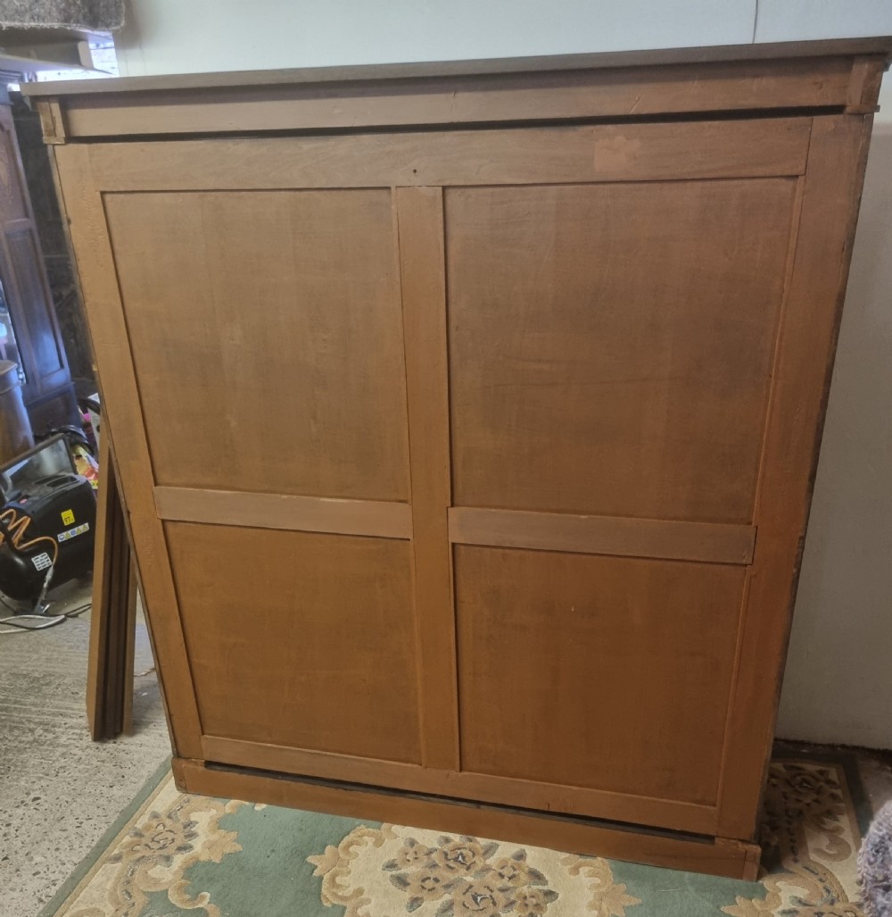 A large Victorian mahogany open bookcase with five adjustable shelves, a moulded upper cornice, and a solid plinth base. View V