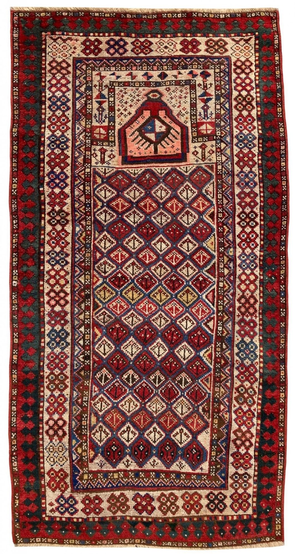 A hand-knotted antique Caucasian Gendje prayer rug featuring a deep red central field with a diamond lattice pattern, topped with a geometric mihrab motif and framed by multi-coloured decorative borders.