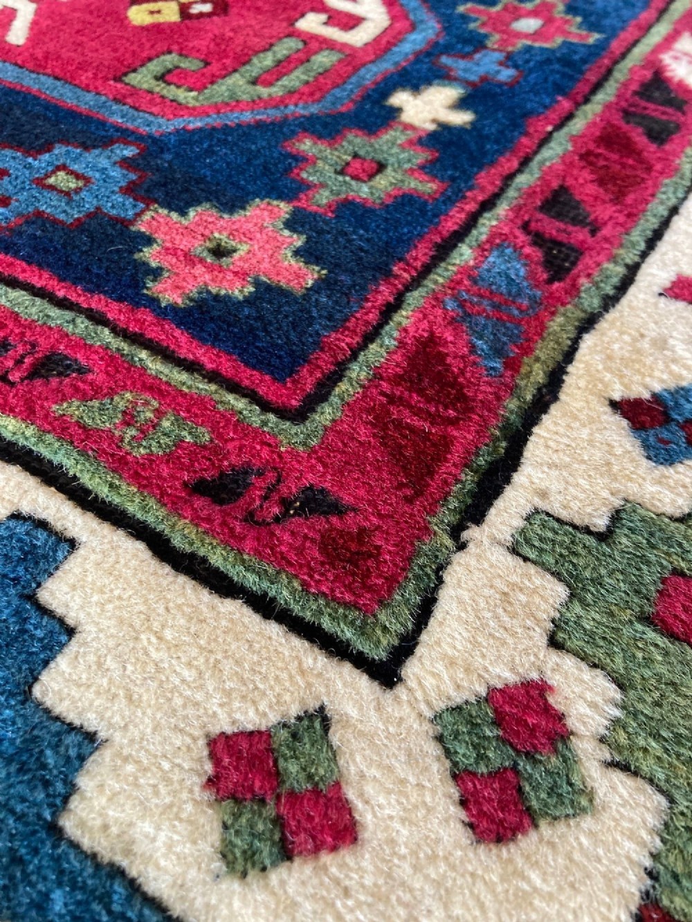 An elongated Caucasian Talish runner rug featuring geometric star motifs and octagons set against a deep indigo field with patterned borders. View IX