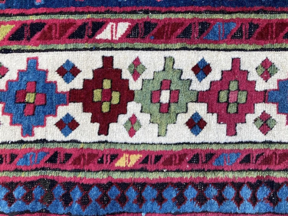 An elongated Caucasian Talish runner rug featuring geometric star motifs and octagons set against a deep indigo field with patterned borders. View XIII