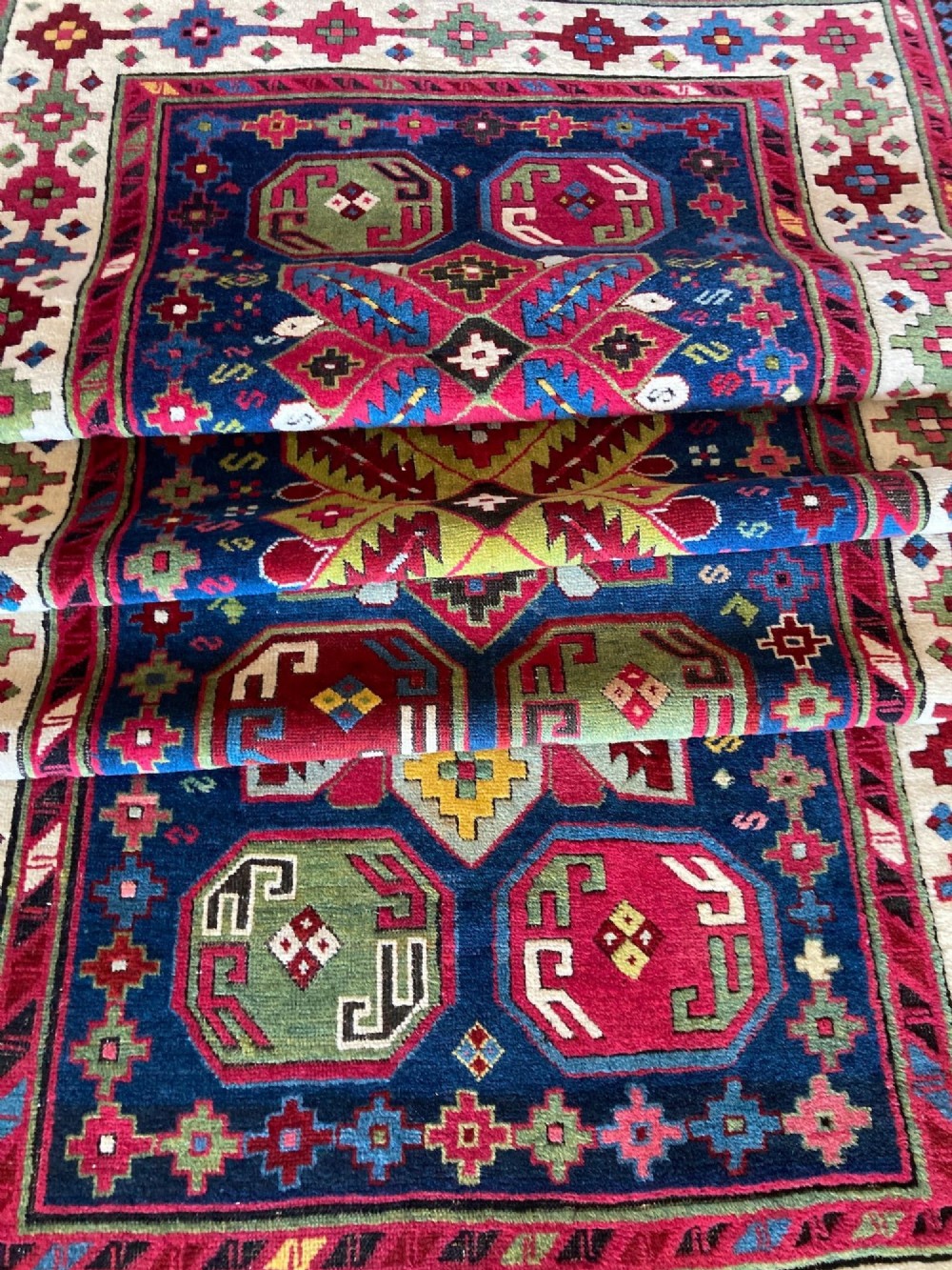 An elongated Caucasian Talish runner rug featuring geometric star motifs and octagons set against a deep indigo field with patterned borders. View XIV