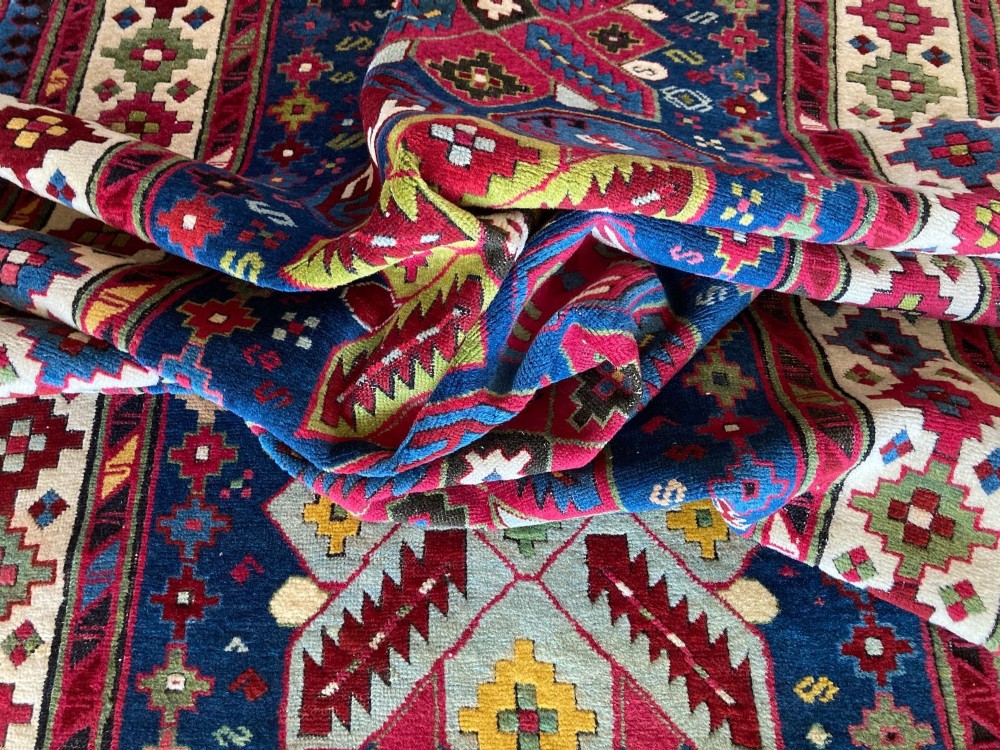 An elongated Caucasian Talish runner rug featuring geometric star motifs and octagons set against a deep indigo field with patterned borders. View XV
