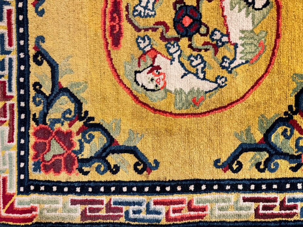 An antique hand-knotted Chinese Ningxia rectangular wool rug featuring a bright yellow field with two circular animal medallions, floral corner accents, and a blue geometric fretwork border. View XIII
