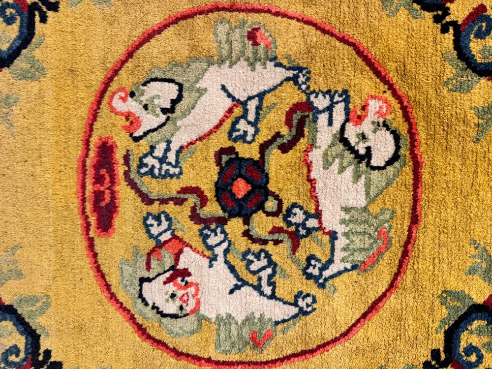 An antique hand-knotted Chinese Ningxia rectangular wool rug featuring a bright yellow field with two circular animal medallions, floral corner accents, and a blue geometric fretwork border. View XIV