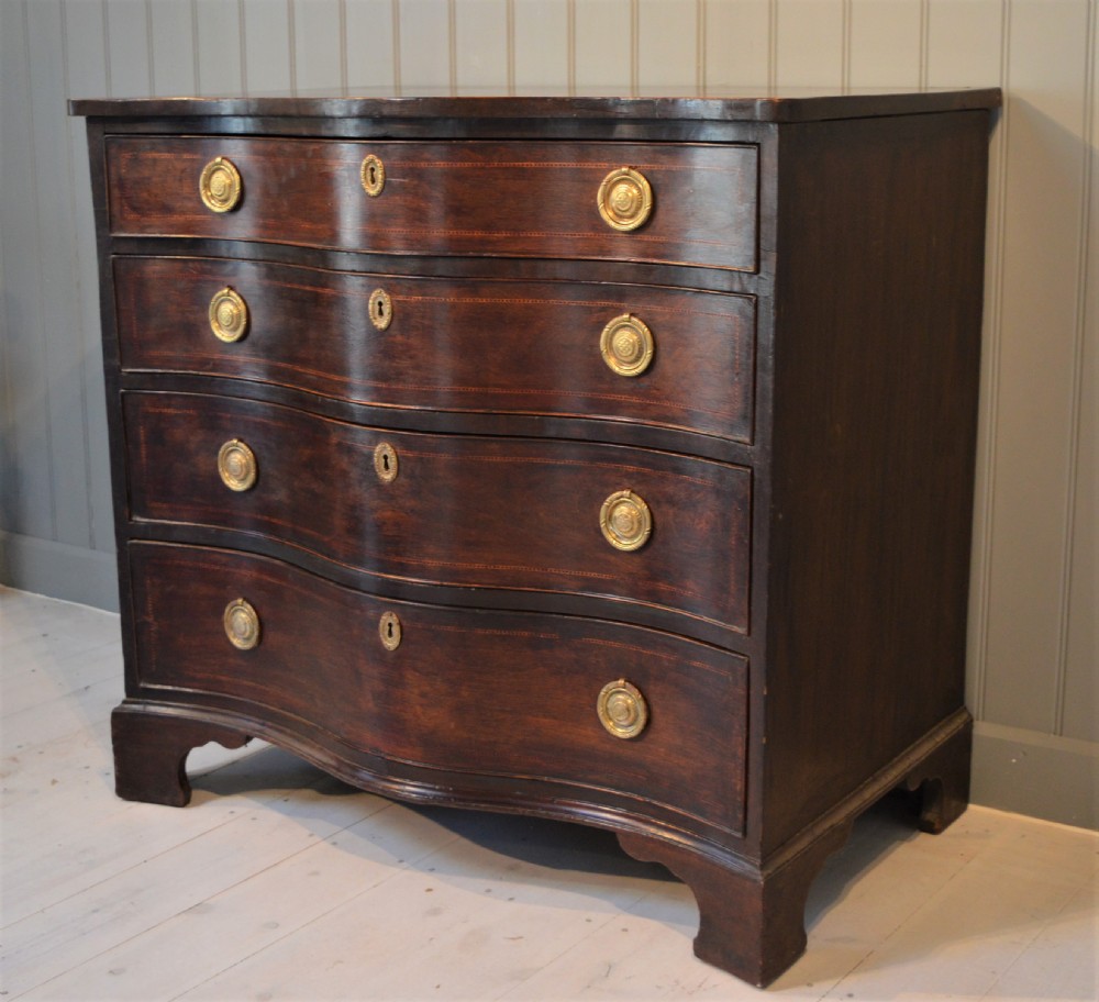 Serpentine mahogany chest of drawers