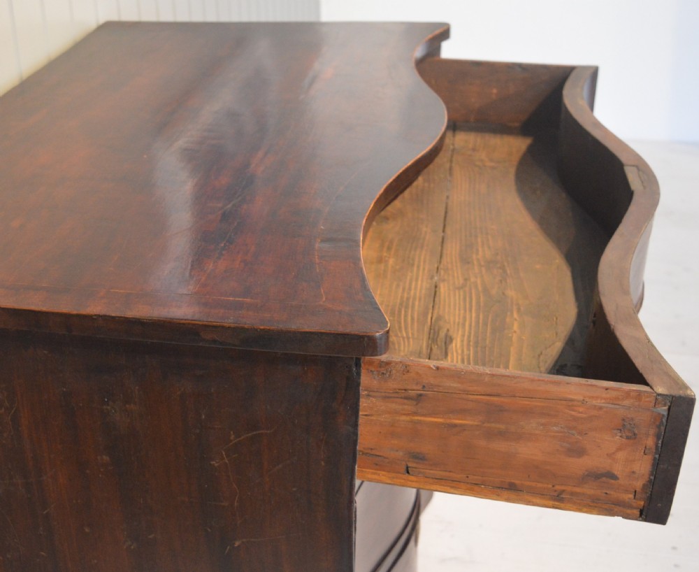 Serpentine mahogany chest of drawers View III