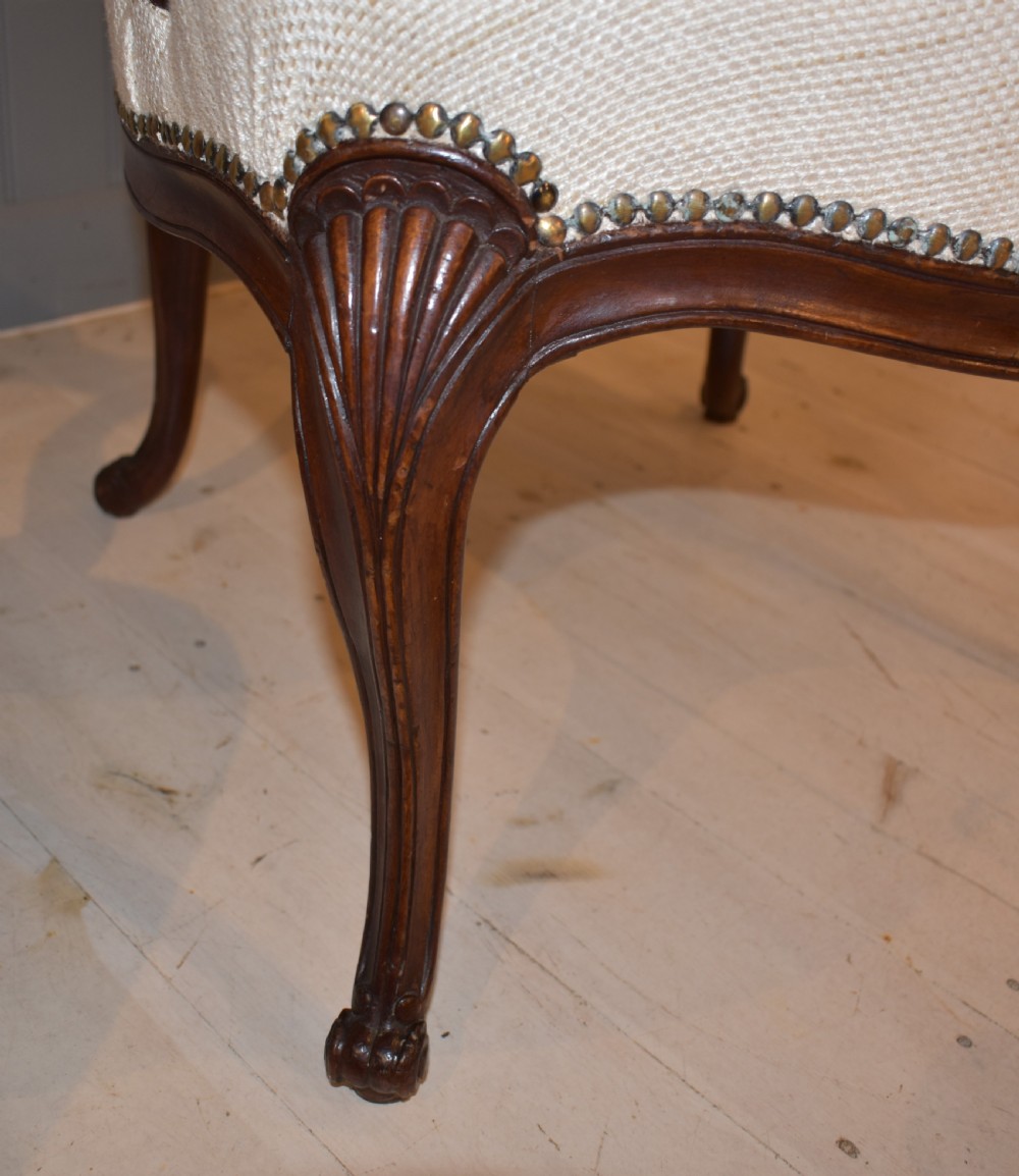 A pair of French Hepplewhite style armchairs upholstered in textured cream linen with carved dark mahogany frames and brass stud detailing. View VII