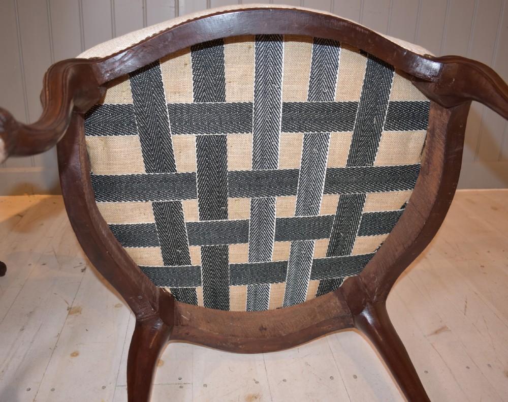 A pair of French Hepplewhite style armchairs upholstered in textured cream linen with carved dark mahogany frames and brass stud detailing. View IX