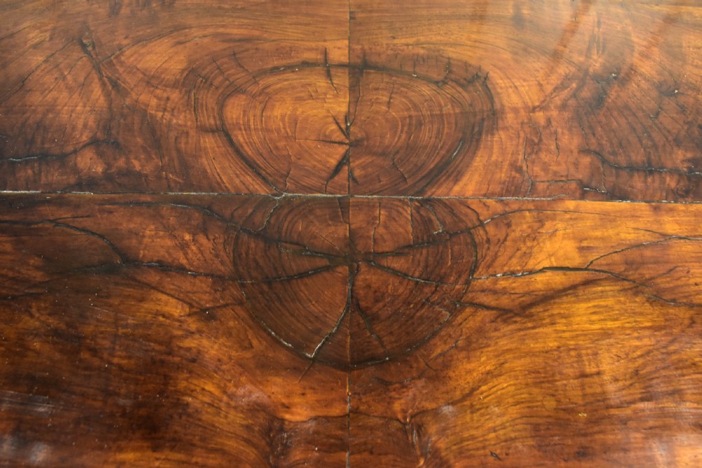 An early 18th-century George I walnut kneehole desk featuring brass handles, a central recessed cupboard, and bracket feet. View VIII