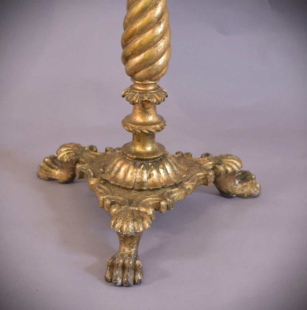 An antique giltwood tripod side table featuring a circular white marble top supported by a spiral twist column and three carved paw feet. View VI