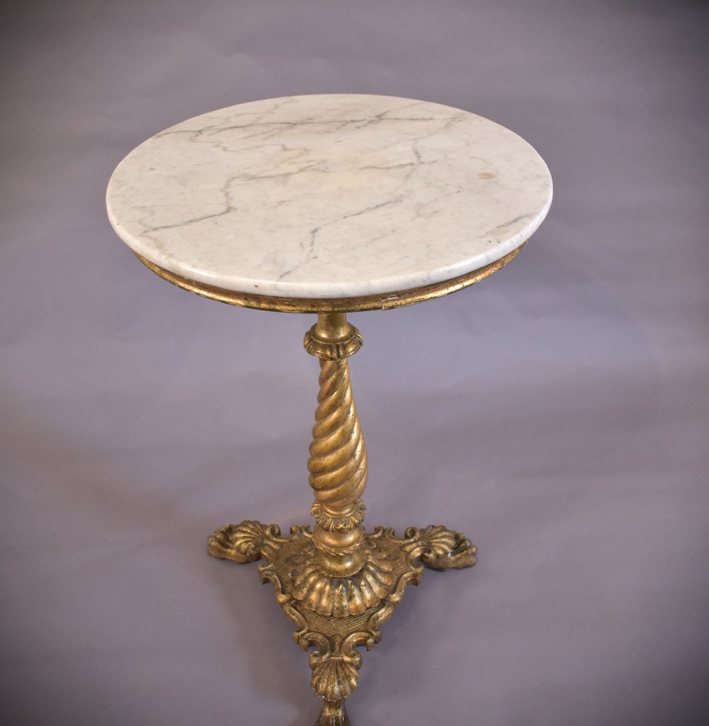 An antique giltwood tripod side table featuring a circular white marble top supported by a spiral twist column and three carved paw feet. View VII