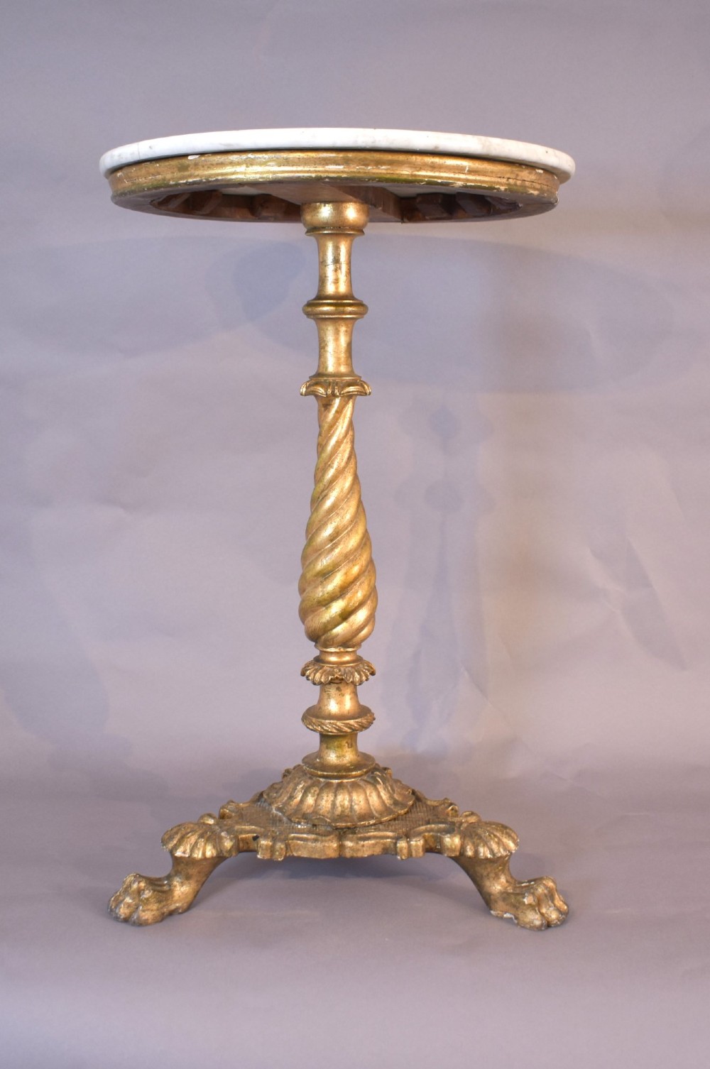An antique giltwood tripod side table featuring a circular white marble top supported by a spiral twist column and three carved paw feet. View XI