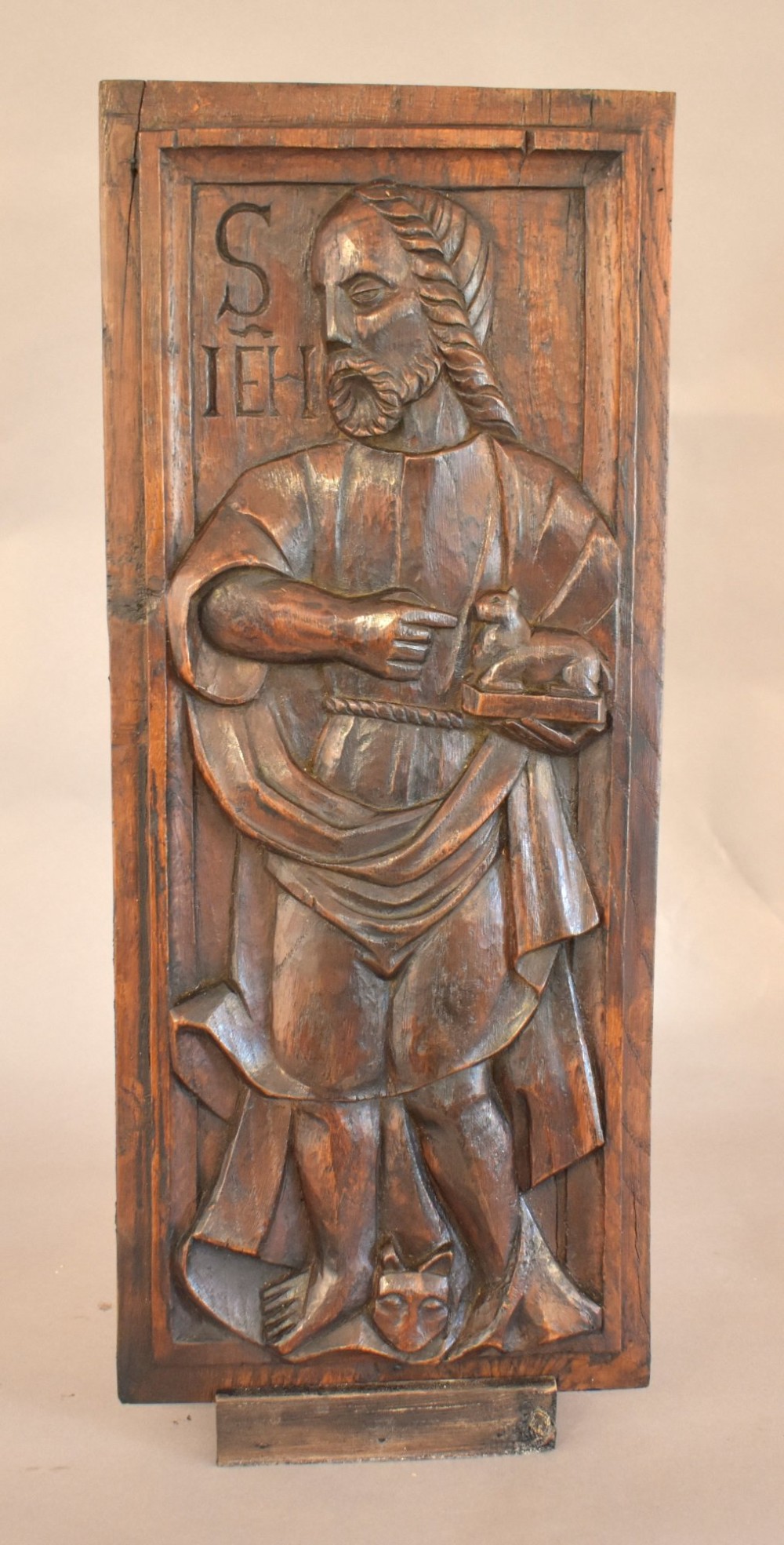 A pair of 17th-century rectangular dark oak timber panels featuring hand-carved relief figures of saints with Latin inscriptions. View VII