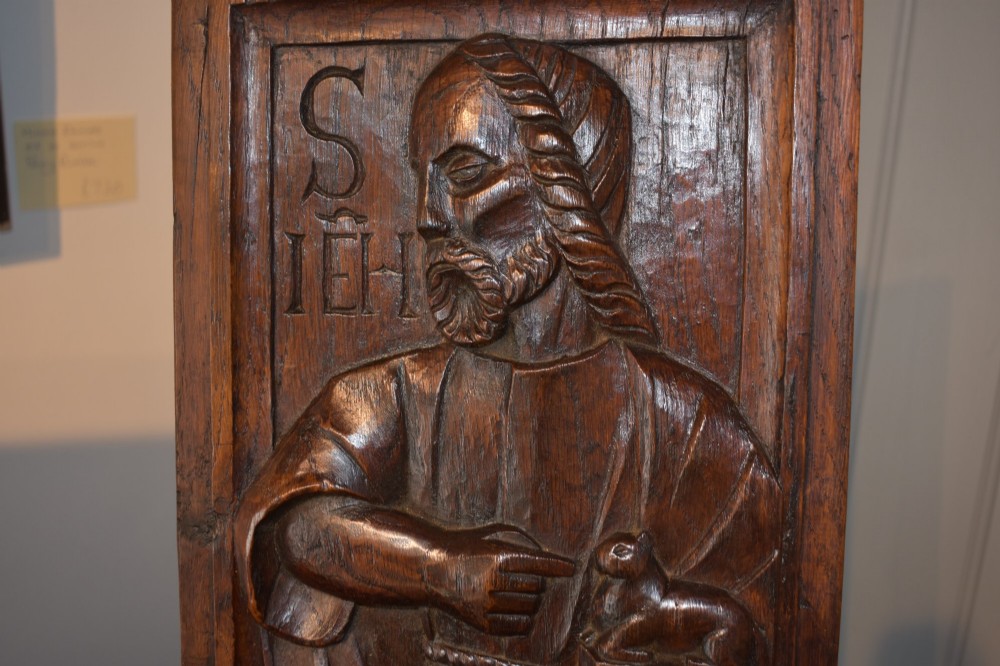 A pair of 17th-century rectangular dark oak timber panels featuring hand-carved relief figures of saints with Latin inscriptions. View VIII
