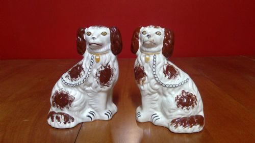 an unusual pair of sponge decorated brown spotted staffordshire pottery flat backed mantle dogs,probaly pratt
