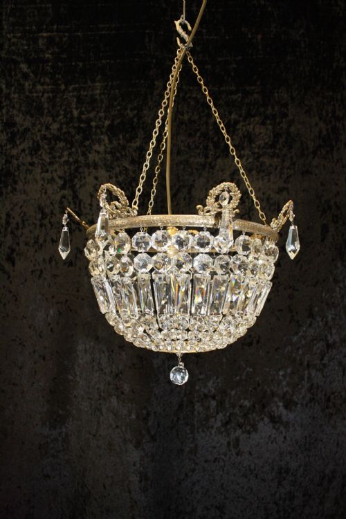 Bag Chandelier with Leaf Decoration Around the Top.