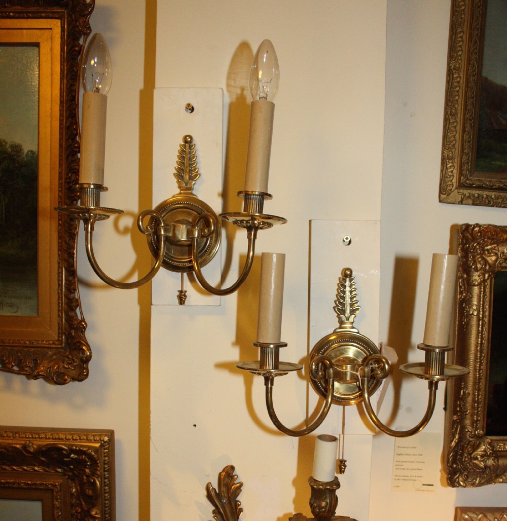 Pair of French wall lights in brass with pull switch