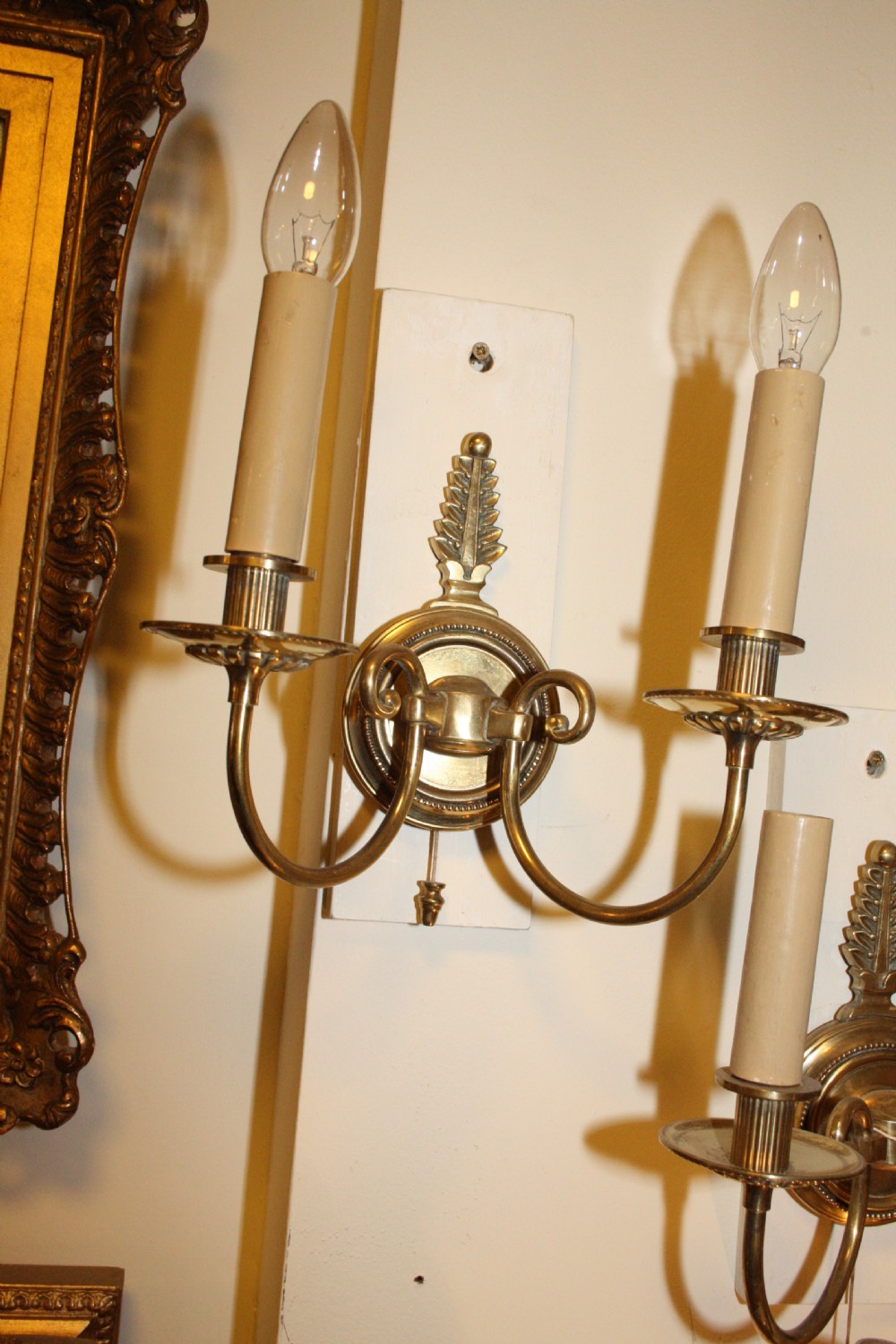 Pair of French wall lights in brass with pull switch View II