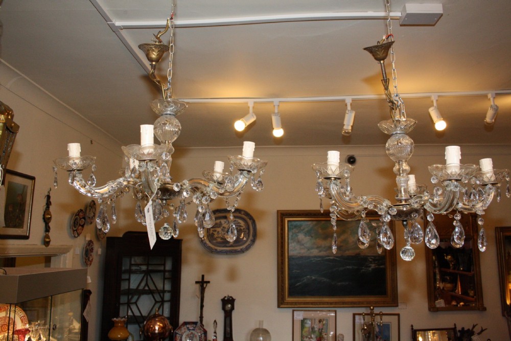 Pair of five arm cut glass chandeliers