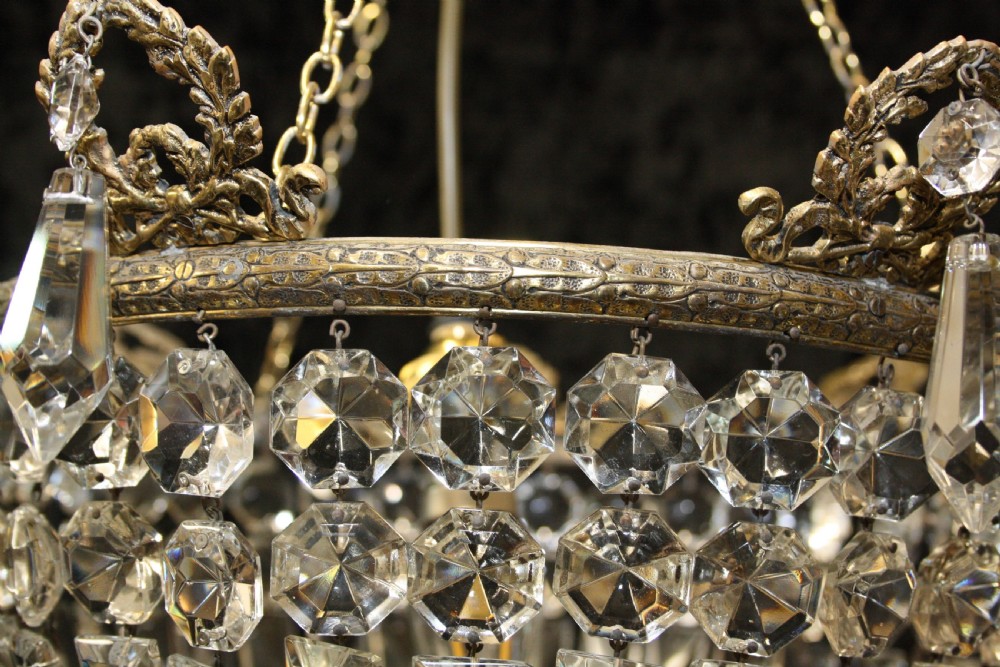Bag chandelier with leaf decoration around the top. View IV