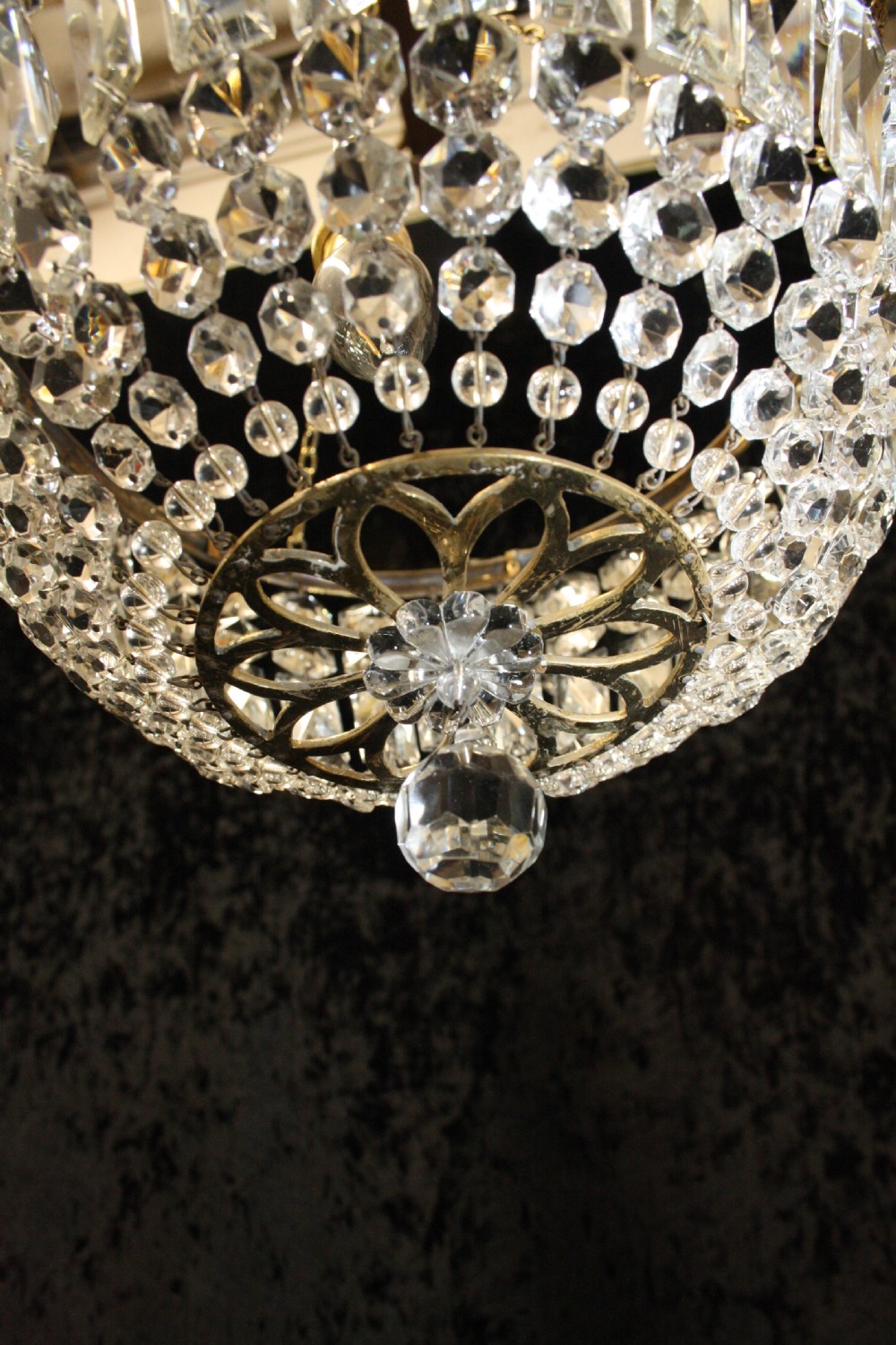 Bag chandelier with leaf decoration around the top. View VII