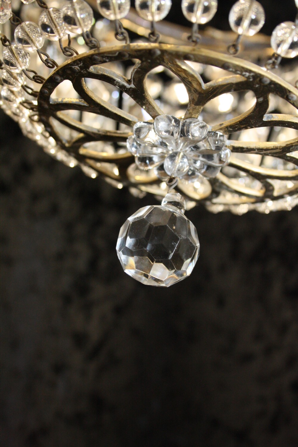 Bag chandelier with leaf decoration around the top. View VIII