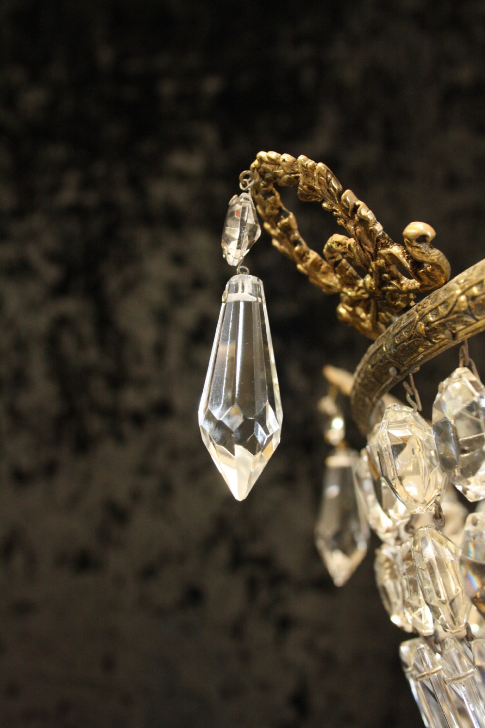 Bag chandelier with leaf decoration around the top. View IX