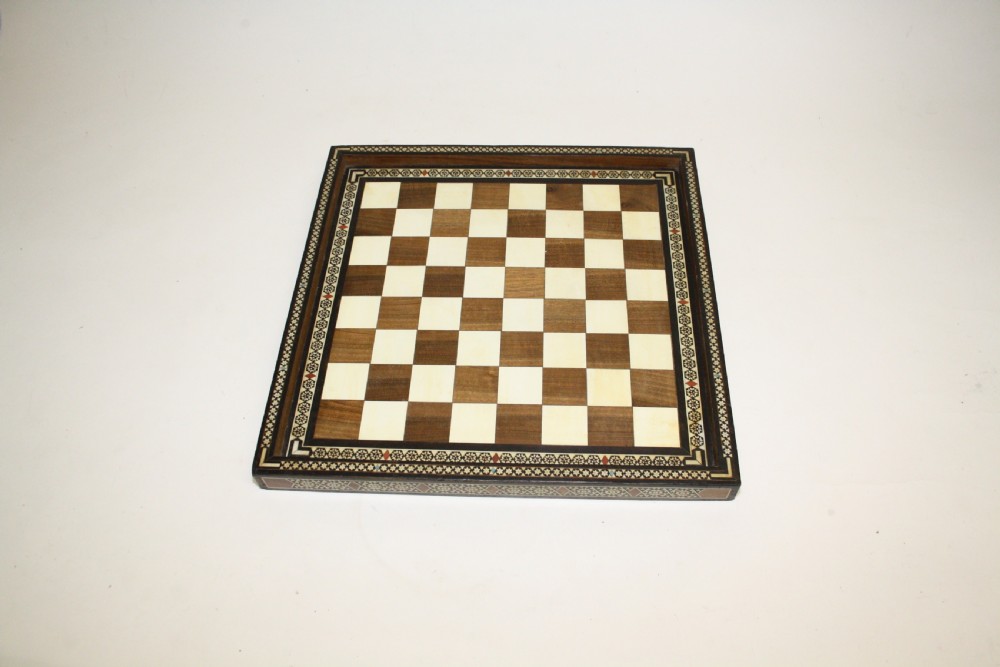 Early 20th century chess board in bone ebony and teak. 