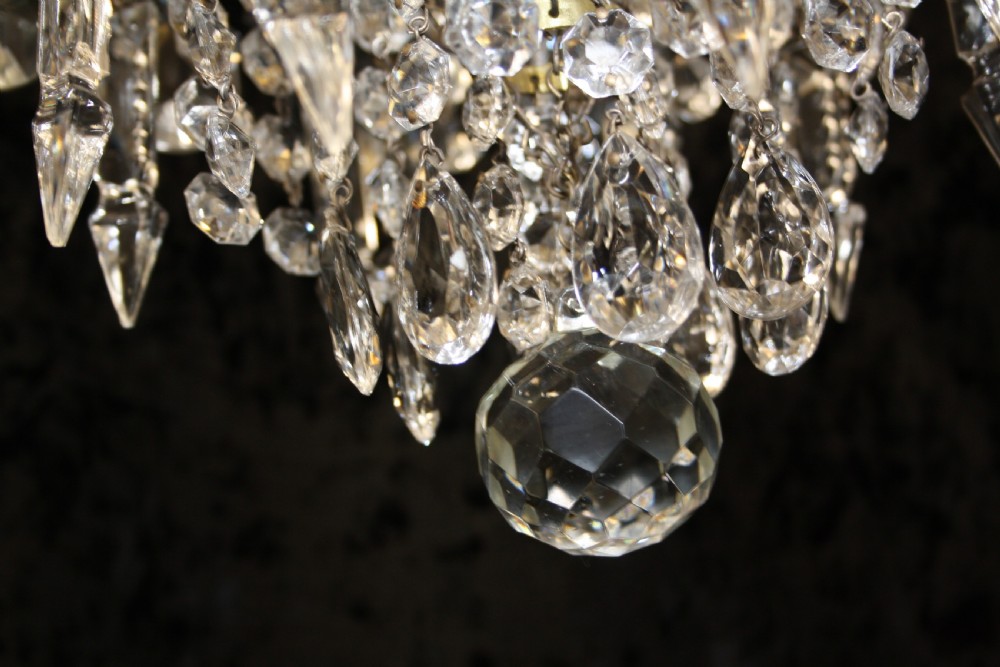 Gilt brass chandelier with unusually large drips to the top. View V
