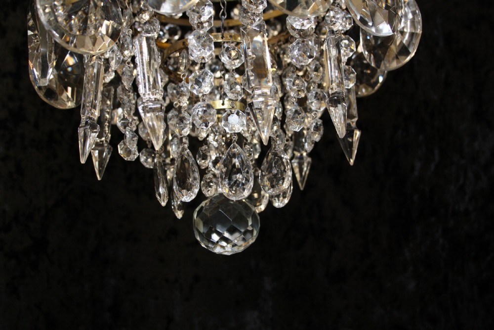 Gilt brass chandelier with unusually large drips to the top. View VI